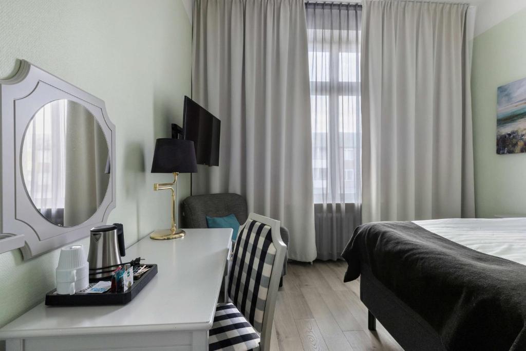 TV a/nebo společenská místnost v ubytování Best Western Hotel Statt Katrineholm