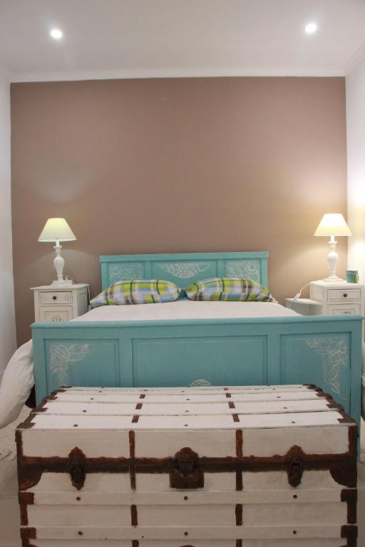 Uma cama ou camas num quarto em Quartos em vivenda serra da Estrela