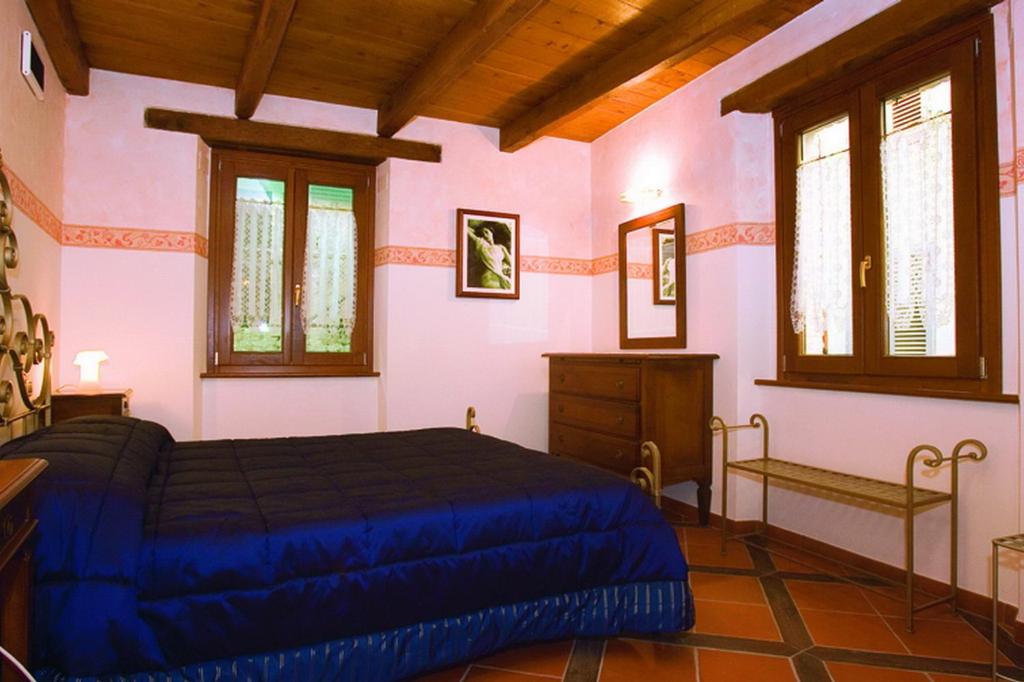 Posteľ alebo postele v izbe v ubytovaní B&B La Torretta sul Borgo