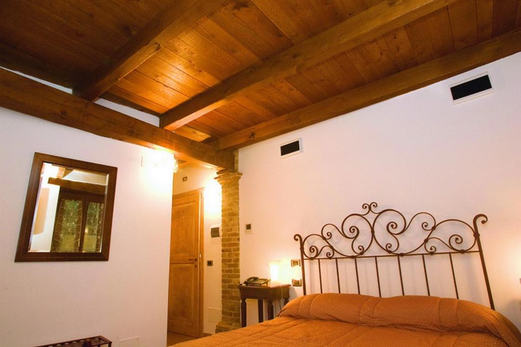 Posteľ alebo postele v izbe v ubytovaní B&B La Torretta sul Borgo