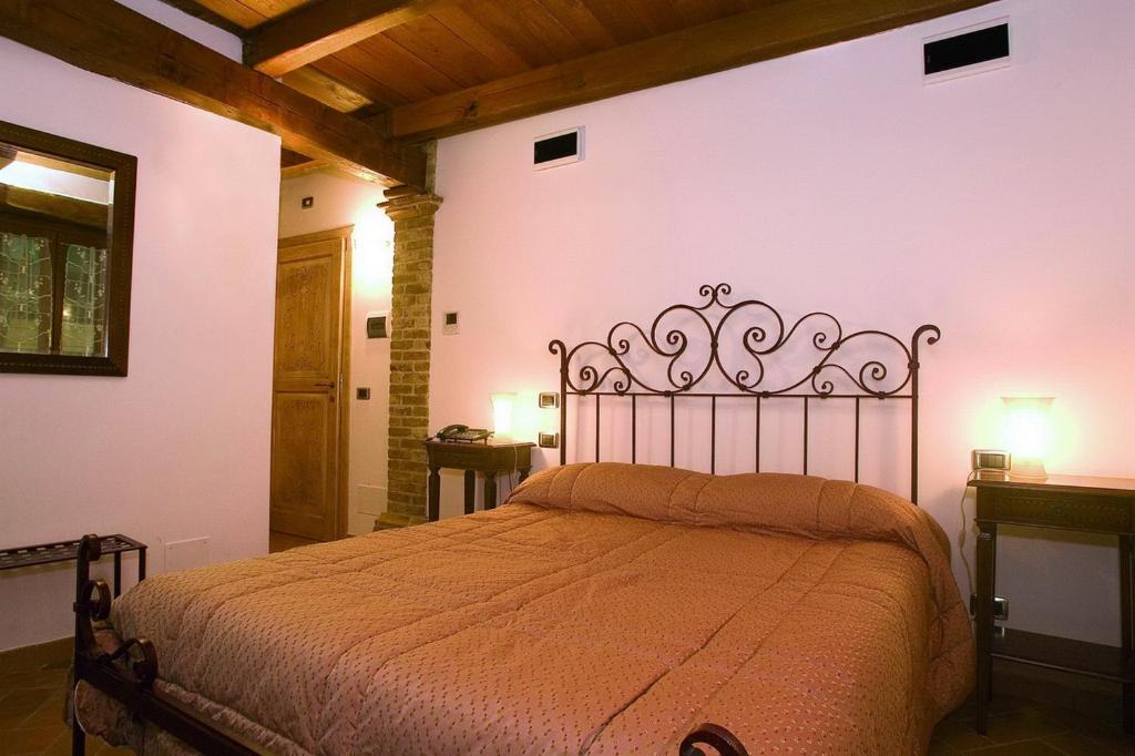 Posteľ alebo postele v izbe v ubytovaní B&B La Torretta sul Borgo