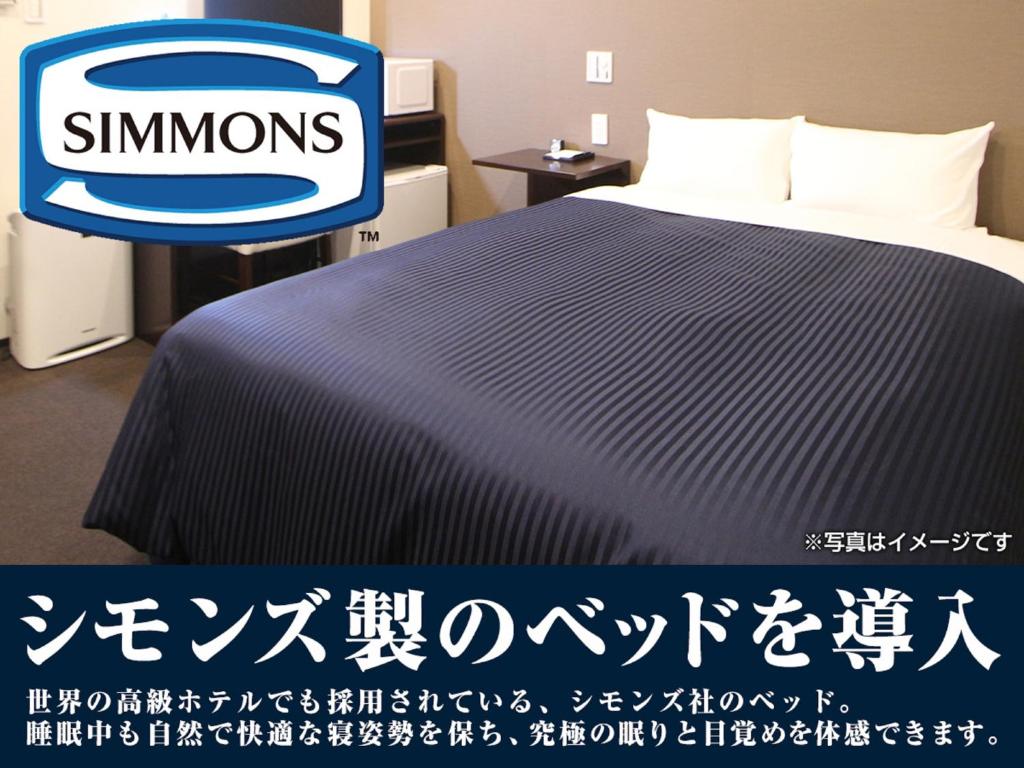 Postel nebo postele na pokoji v ubytování HOTEL LiVEMAX Tokyo Shintomicho