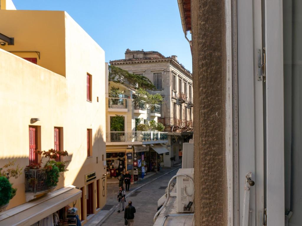 a view of a street from a building at Hadrians Den in Heart of Plaka by JJ Hospitality in Athens