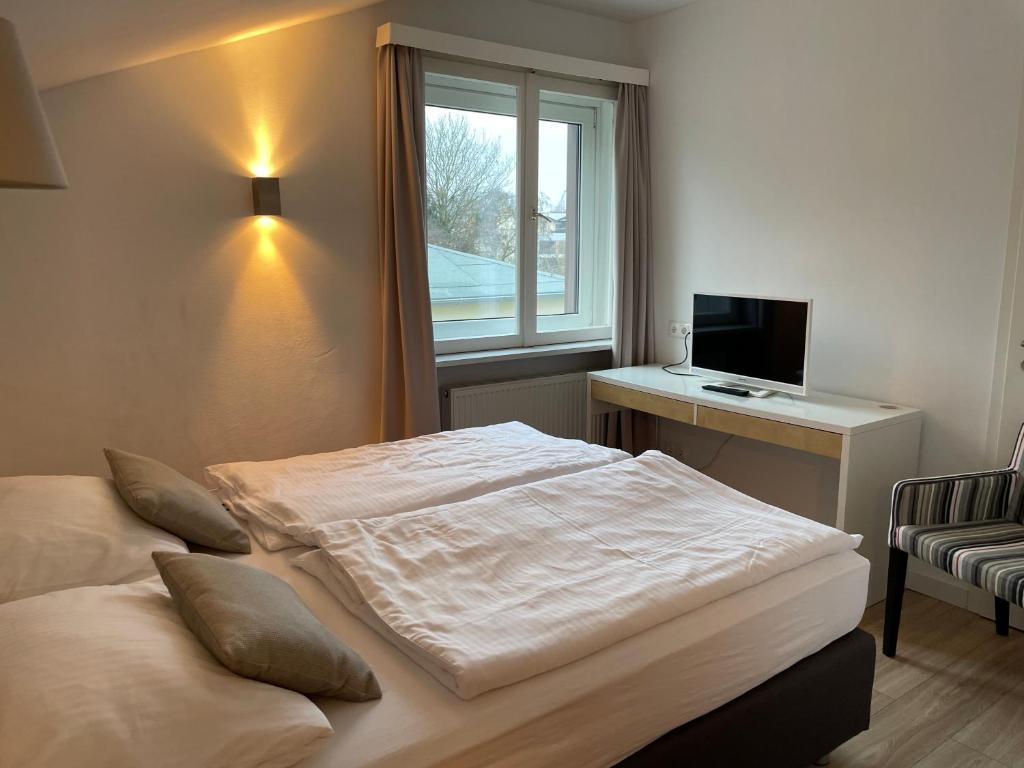 Postel nebo postele na pokoji v ubytování ApartHotel Stadtpark
