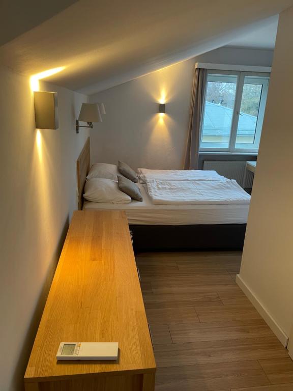 Postel nebo postele na pokoji v ubytování ApartHotel Stadtpark
