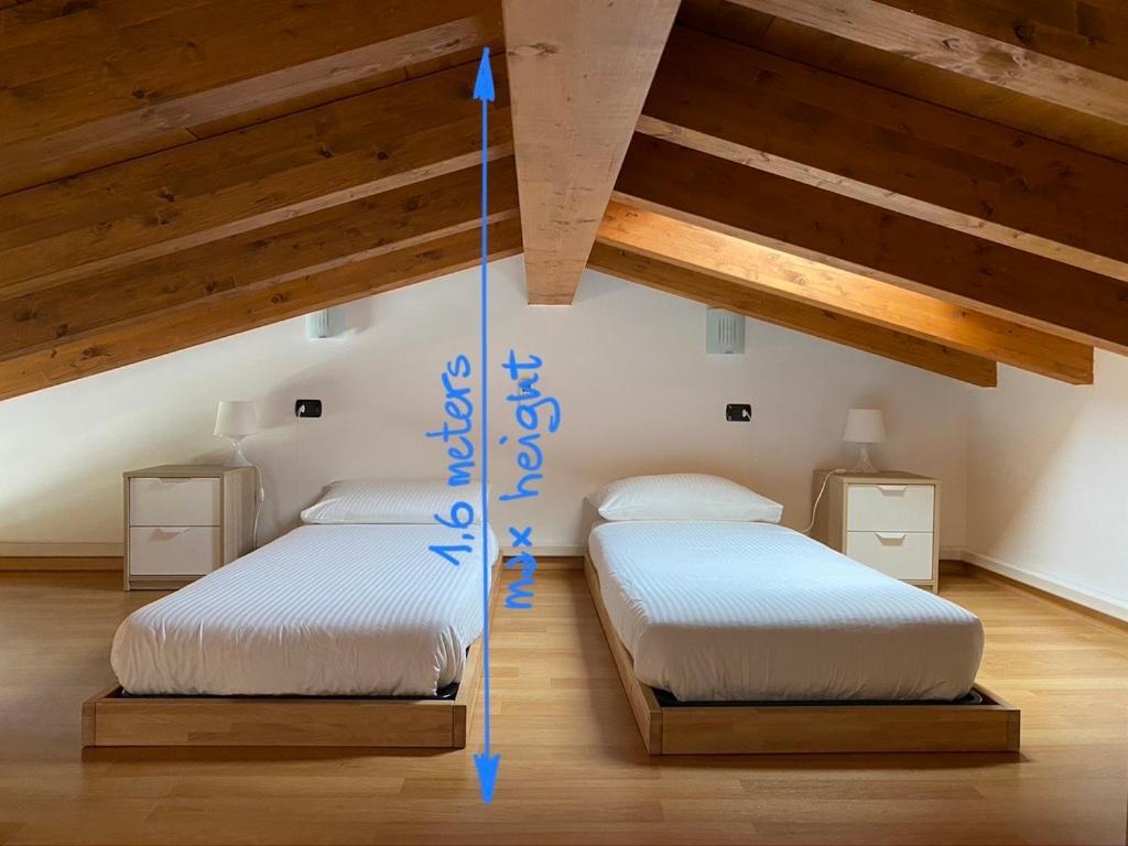 Postel nebo postele na pokoji v ubytování La Valletta Suite