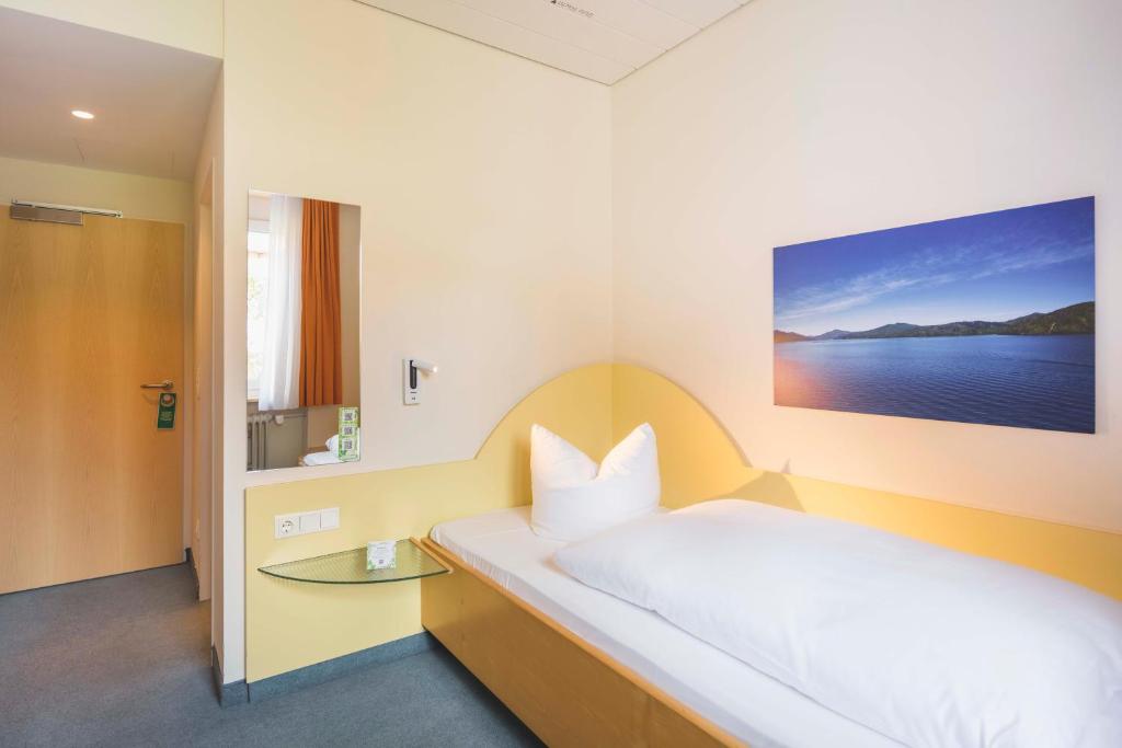 Postel nebo postele na pokoji v ubytování Hotel Luise