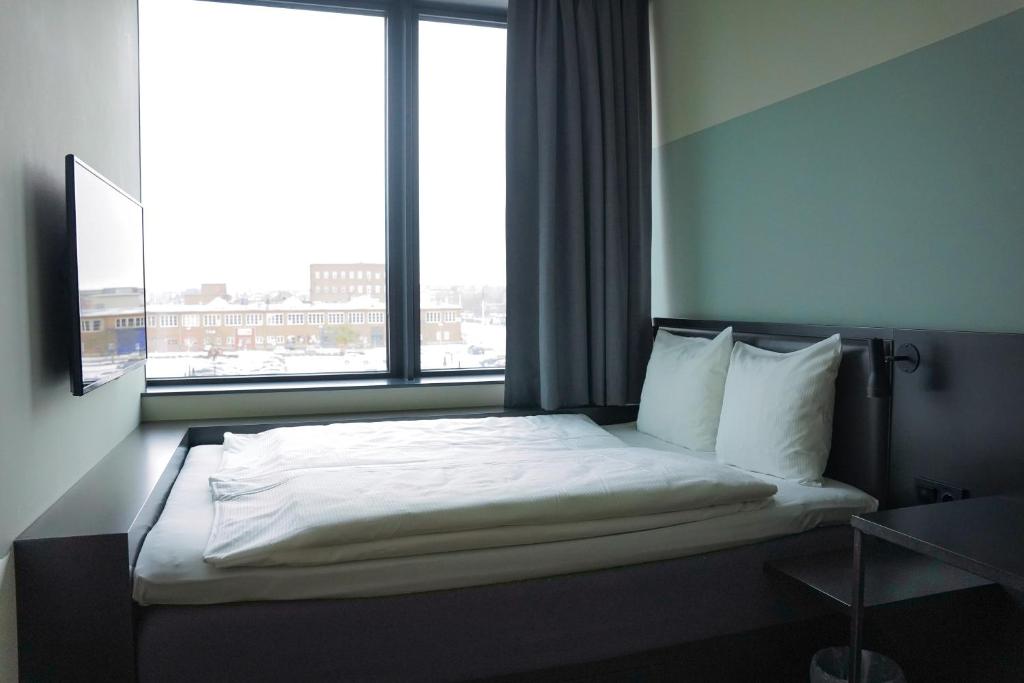 Postel nebo postele na pokoji v ubytování Comfort Hotel Västerås