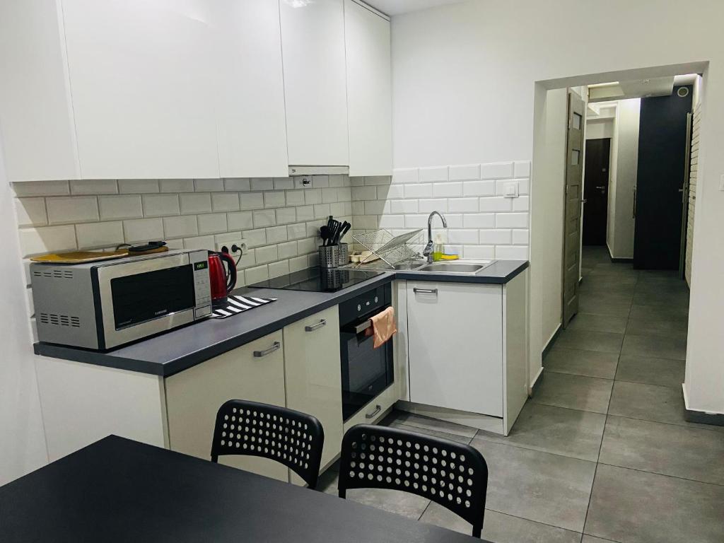 Kuchyňa alebo kuchynka v ubytovaní White Apartment