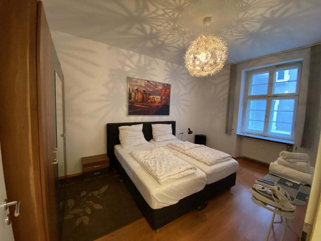Ένα ή περισσότερα κρεβάτια σε δωμάτιο στο 2 Zimmer Appartement am Bismarckplatz Heidelberg