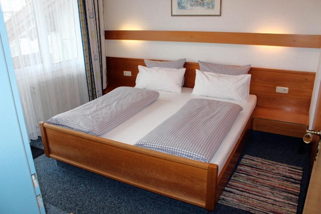 Postel nebo postele na pokoji v ubytování Appartement-Hotel Happy Kienberg