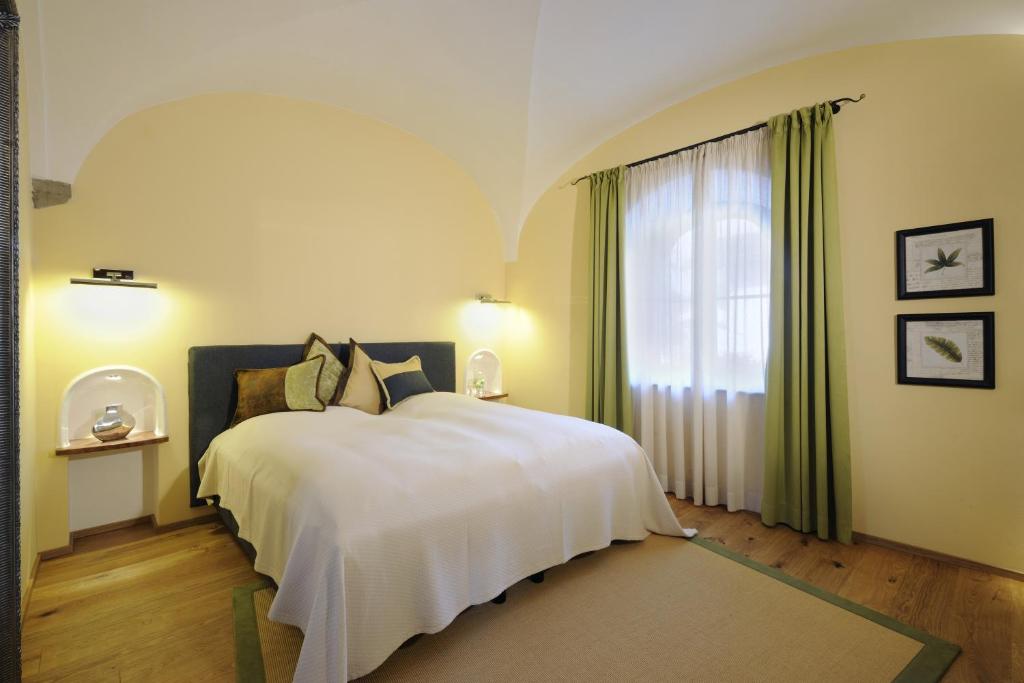 Postel nebo postele na pokoji v ubytování Hotel Gut Ising