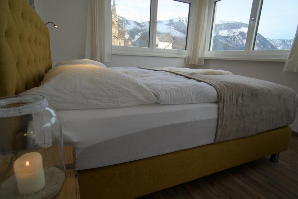 Postel nebo postele na pokoji v ubytování Dangos Mountainview Gosau