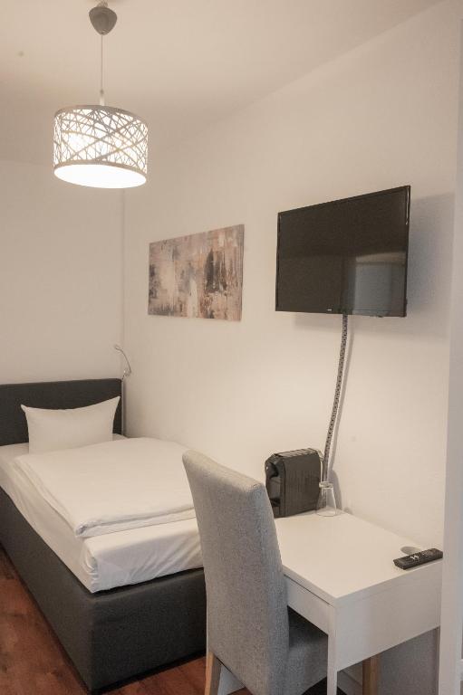 TV a/nebo společenská místnost v ubytování Hotel Teatro