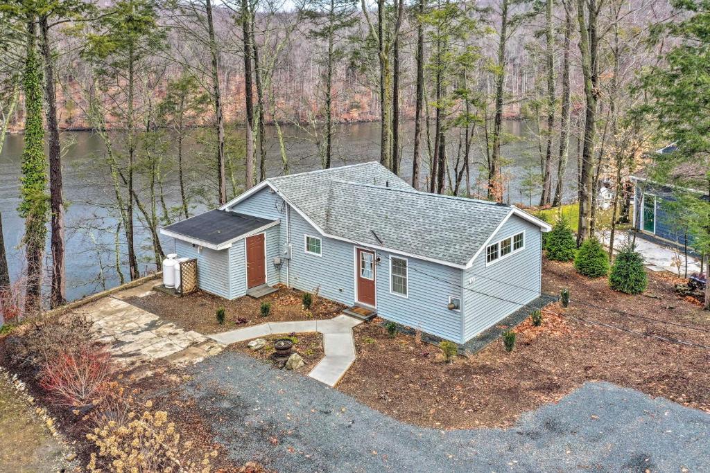 an aerial view of a tiny house in the woods at Waterfront Retreat with Boat Dock and Fire Pit! in Southbury