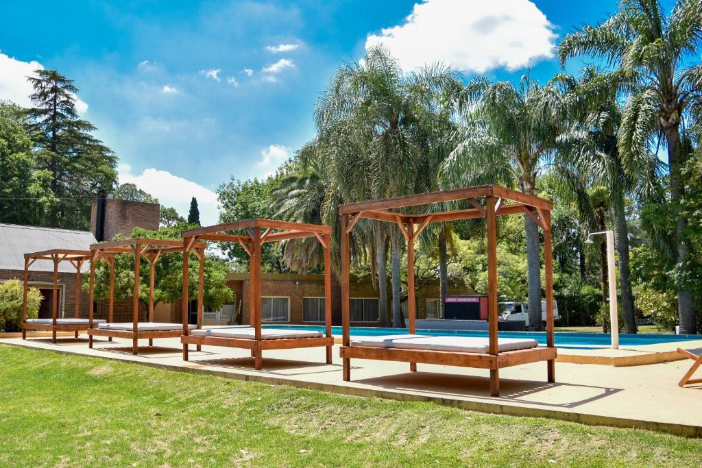 a group of benches in front of a pool at Parador 15 in Funes