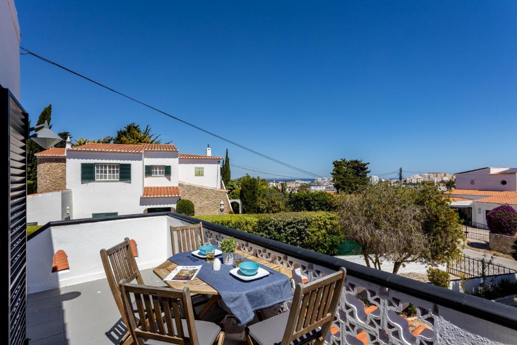 a patio with a table and chairs on a balcony at Casa Furneaux by Seewest in Lagos