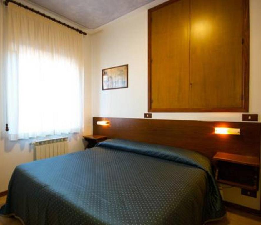 Postel nebo postele na pokoji v ubytování Affittacamere Dal Falco