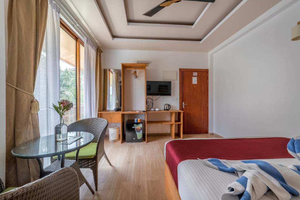 Postel nebo postele na pokoji v ubytování Ocean Lilly Inn