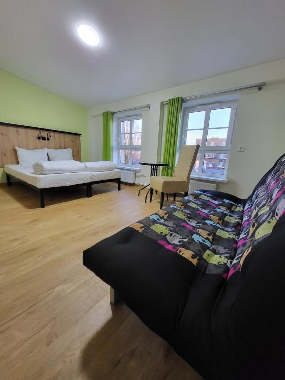 Postel nebo postele na pokoji v ubytování FOKA Hostel