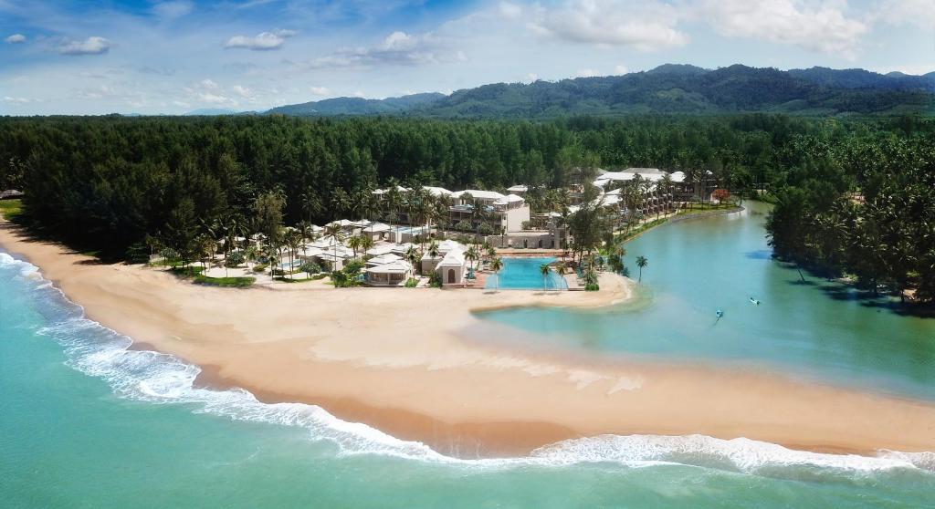 an aerial view of a resort on a beach at Devasom Khao Lak Beach Resort & Villas in Khao Lak