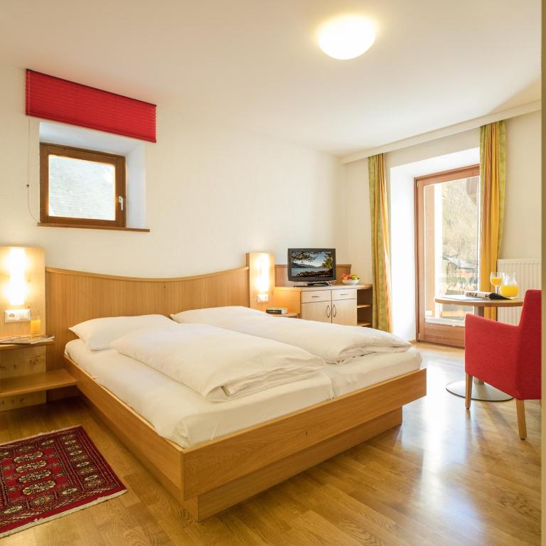 Postel nebo postele na pokoji v ubytování Ferienhof Neusacher Moser
