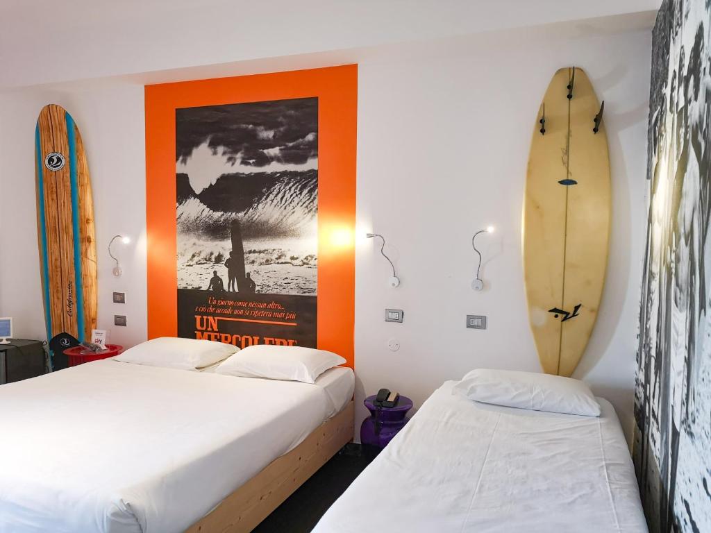 Postel nebo postele na pokoji v ubytování Hotel Perla - The storyhoteller