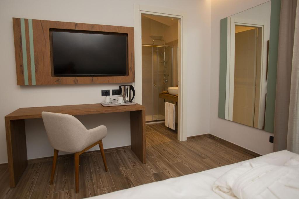 Łóżko lub łóżka w pokoju w obiekcie Donna Vì Hotel