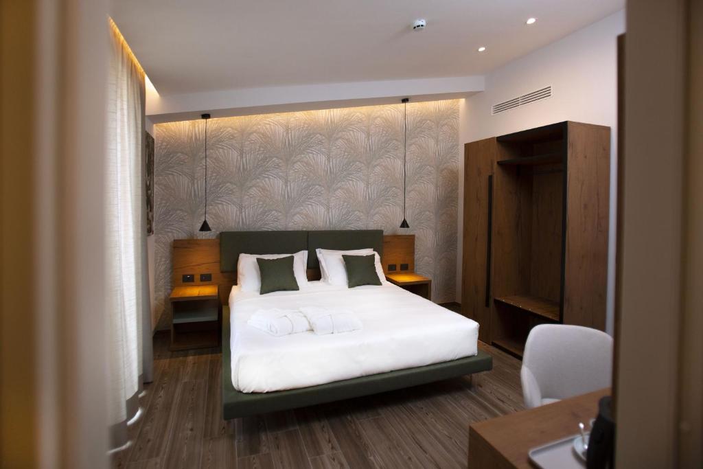 Łóżko lub łóżka w pokoju w obiekcie Donna Vì Hotel