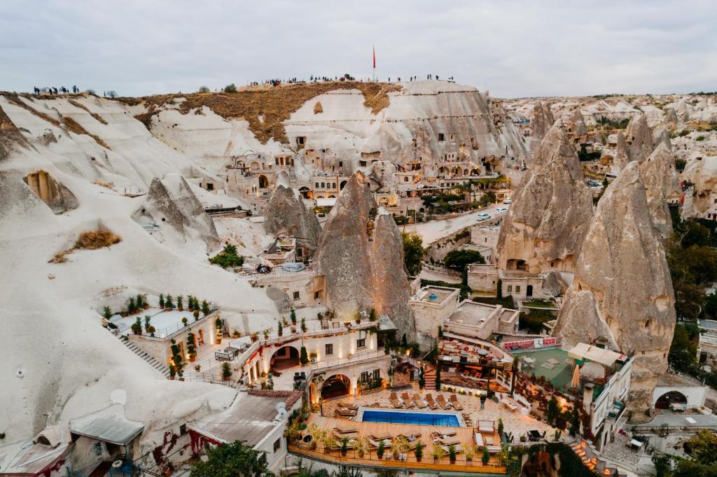 an aerial view of a resort in the mountains at Local Cave House Hotel in Göreme