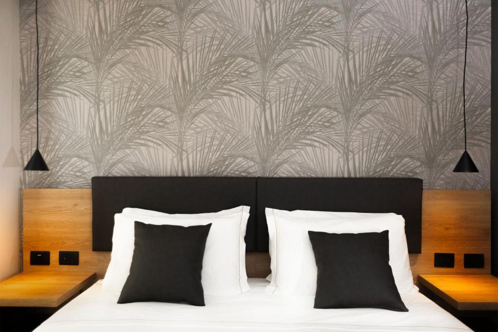 Łóżko lub łóżka w pokoju w obiekcie Donna Vì Hotel