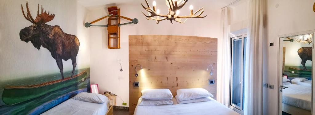 Postel nebo postele na pokoji v ubytování Hotel Perla - The storyhoteller
