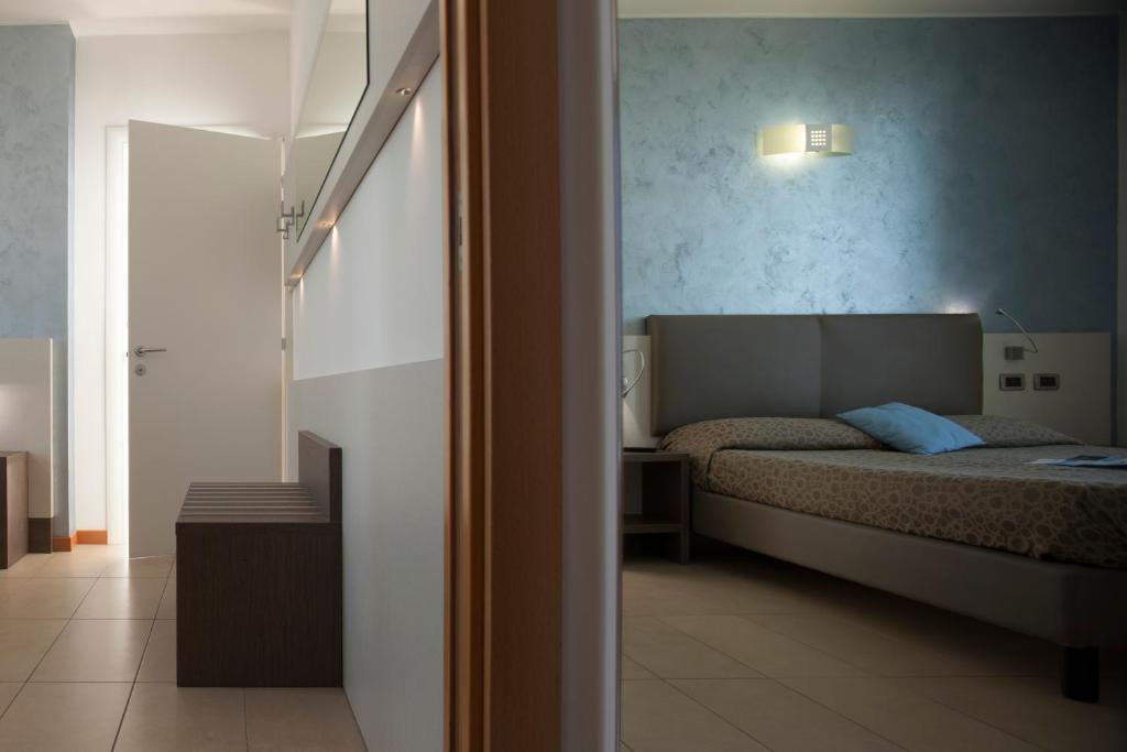 Postel nebo postele na pokoji v ubytování Hotel Tropical