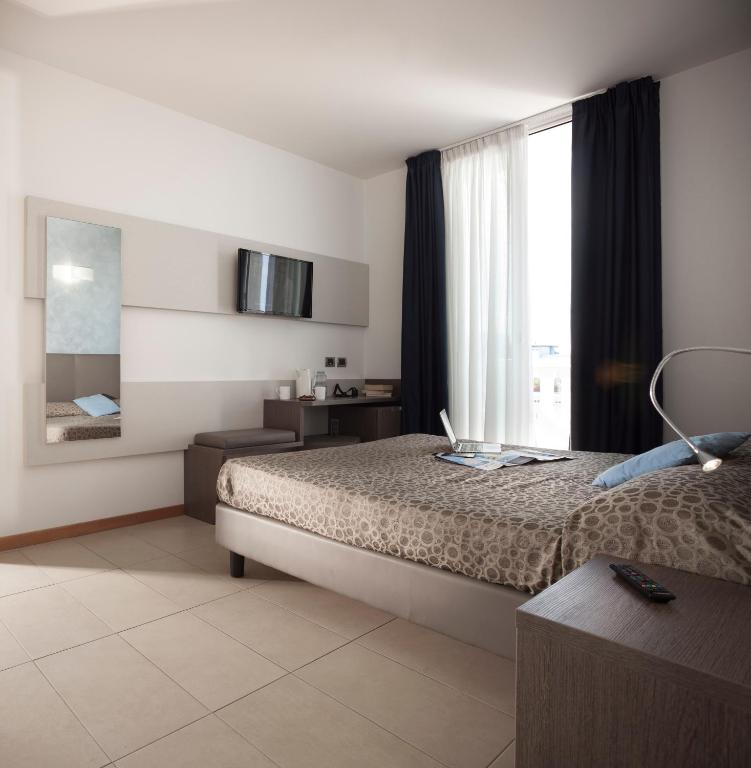 Postel nebo postele na pokoji v ubytování Hotel Tropical