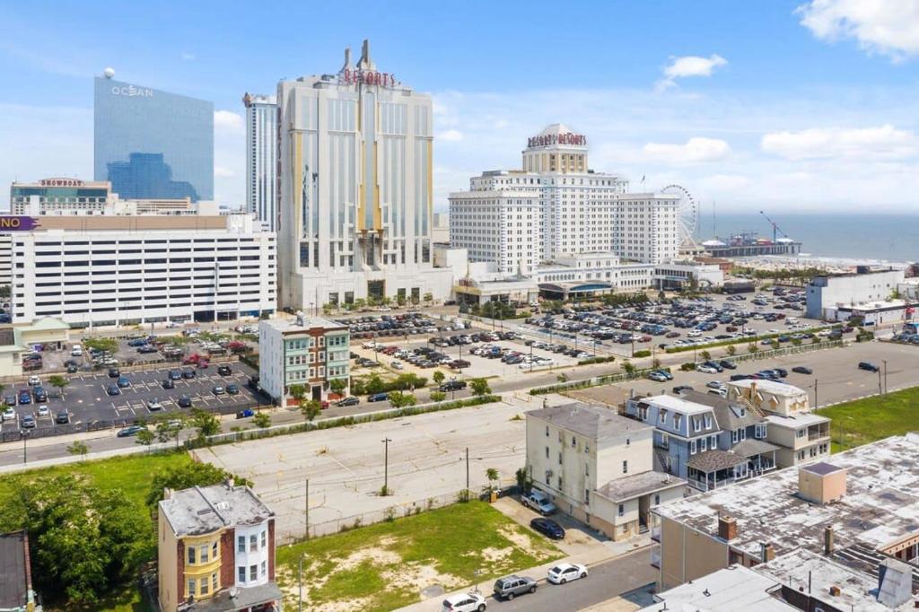 a city with tall buildings and a parking lot at 5BR Beach Block Orange Loop Steps from Boardwalk in Atlantic City