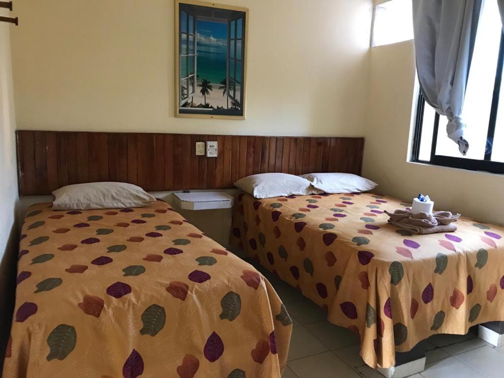 Postel nebo postele na pokoji v ubytování Hotel Sociedad y Maristas