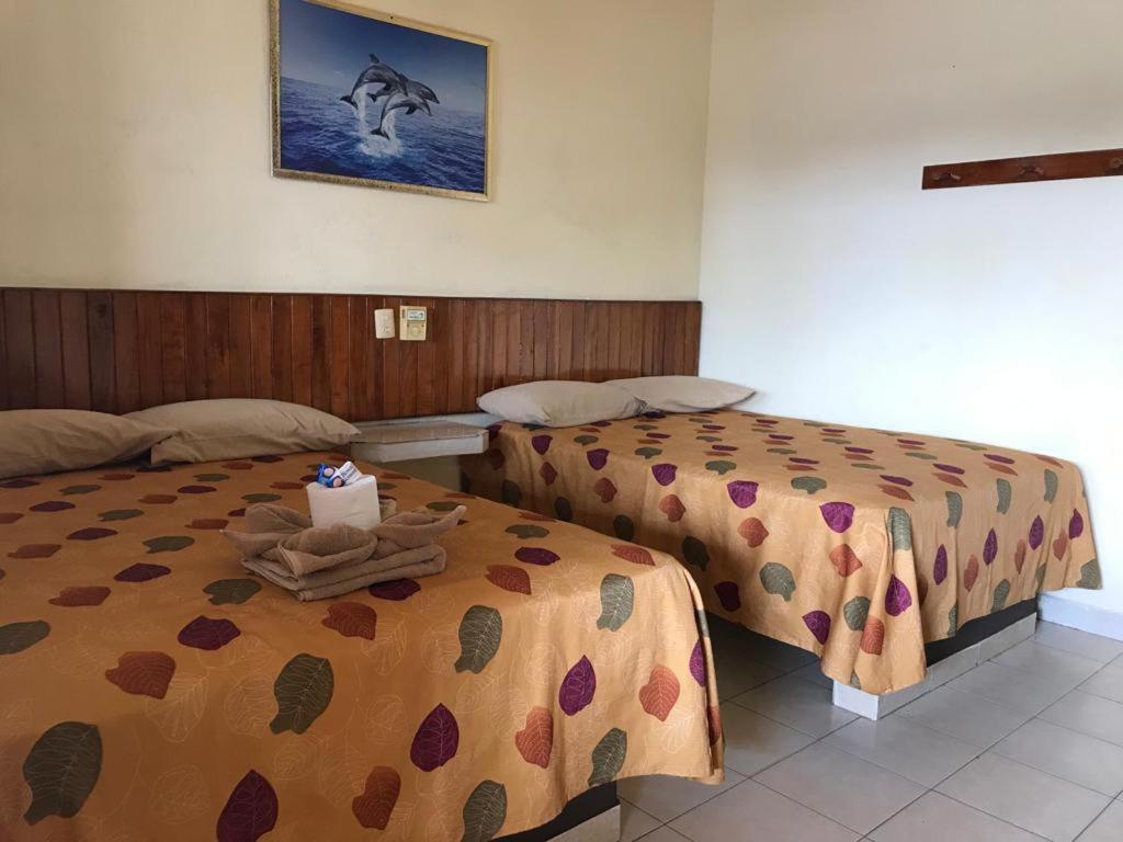 Postel nebo postele na pokoji v ubytování Hotel Sociedad y Maristas
