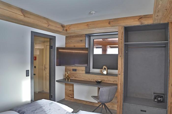 Postel nebo postele na pokoji v ubytování Sieglhub Chalets - Appartements - Hotel