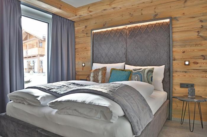 Postel nebo postele na pokoji v ubytování Sieglhub Chalets - Appartements - Hotel