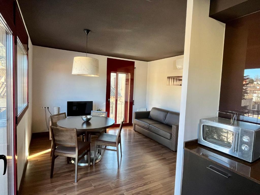 Televízia a/alebo spoločenská miestnosť v ubytovaní Can Morera Apartaments a Les Preses