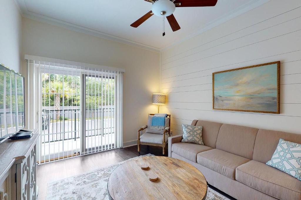 a living room with a couch and a table at Queen Suite @ 400 Ocean Suites in Golf Retreat