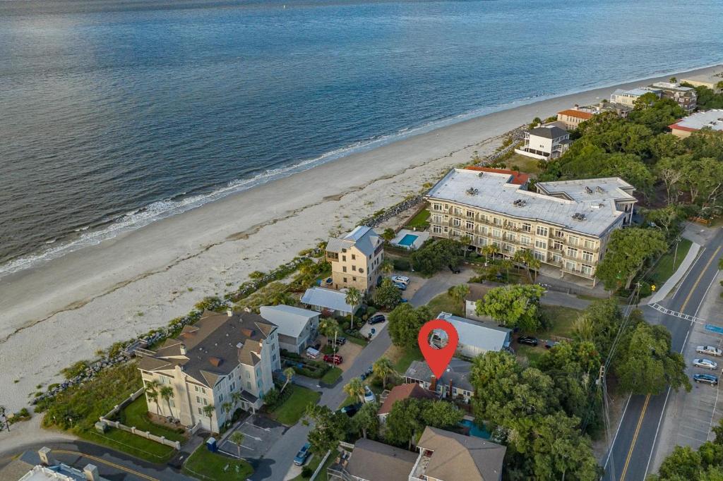 an aerial view of a beach with a building and a red marker at Waterside - 829 Park Way in Saint Simons