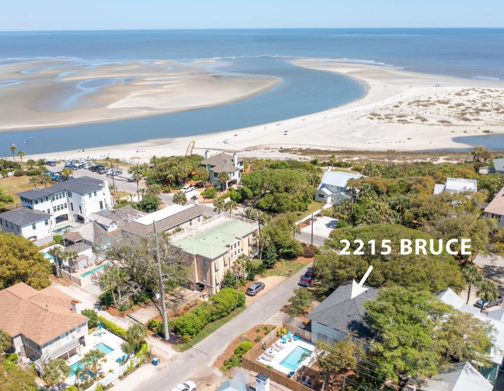 an aerial view of a town with a beach at Three Oaks Beach Cottage - 2215 Bruce Drive in Saint Simons Island