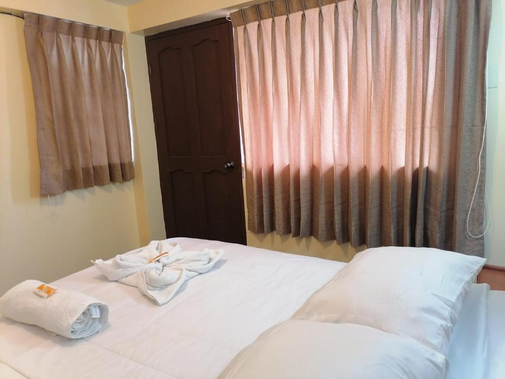 Postel nebo postele na pokoji v ubytování Suyay B&B