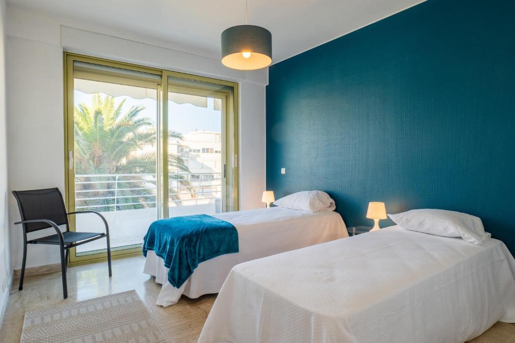 Posteľ alebo postele v izbe v ubytovaní PANORAMIC SEA VIEW - 2-Br Apartment Mouré Rouge
