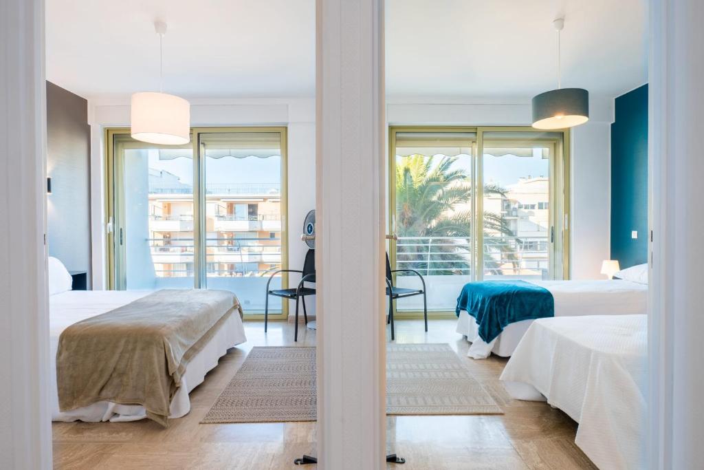 Posteľ alebo postele v izbe v ubytovaní PANORAMIC SEA VIEW - 2-Br Apartment Mouré Rouge