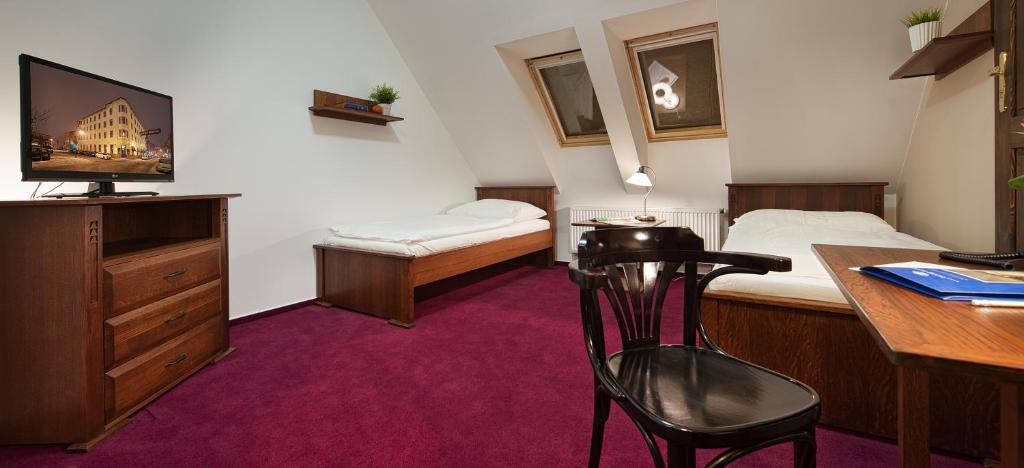 Postel nebo postele na pokoji v ubytování Brioni Boutique Hotel 4*
