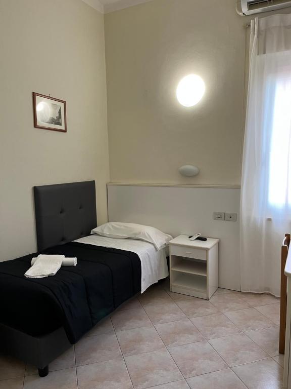 Postel nebo postele na pokoji v ubytování R&B Hotel