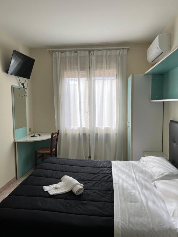 Postel nebo postele na pokoji v ubytování R&B Hotel