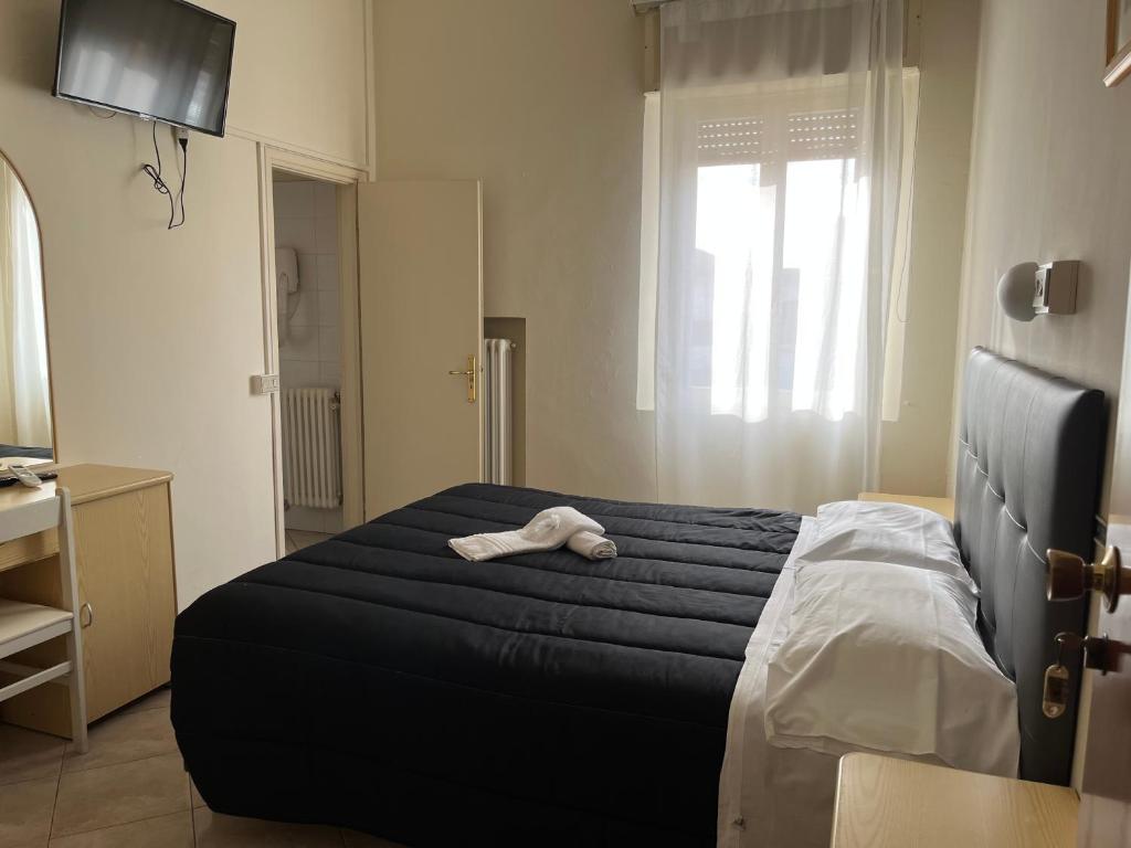 Postel nebo postele na pokoji v ubytování R&B Hotel